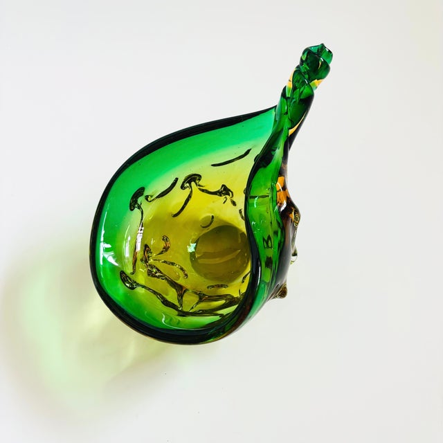 A vintage Murano art glass bowl. Nice large size in a unique shape meant to resemble a conch shell. Textured base with a...