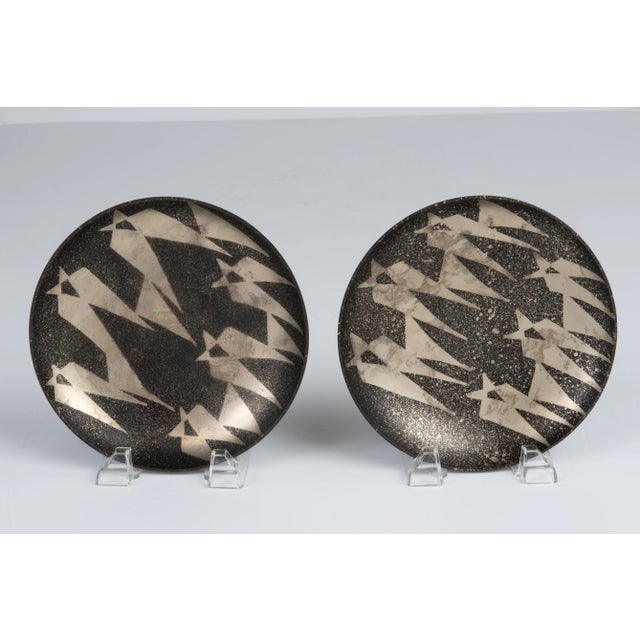 A pair of 1970s brass plates. Well made and solid, they are made in India but otherwise unmarked. The abstract design...