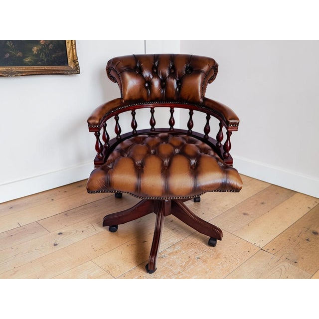 Antique Style Chesterfield Brown Buttoned Leather Swivel Captains Chair - Exceptional Condition 1990's This is an...