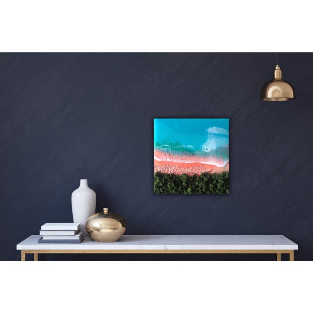 The artwork depicts a vibrant beach scene, capturing the interplay of turquoise waters and a soft, sandy shore. Textured...