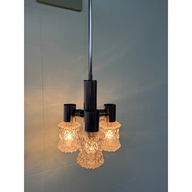 Vintage chandelier from the 1970s made by the Italian company Targetti (the brand is present on the chandelier). This...