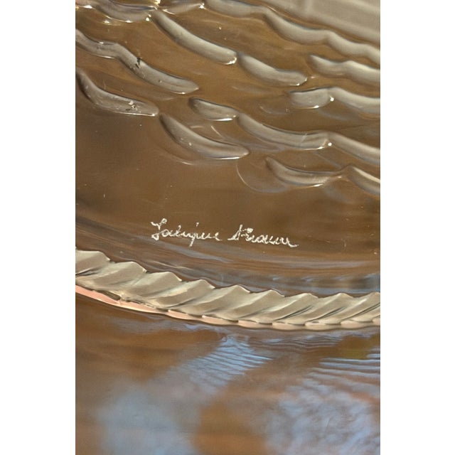 A striking set of three vintage Lalique France crystal plates, each featuring a different sailing ship rendered in...