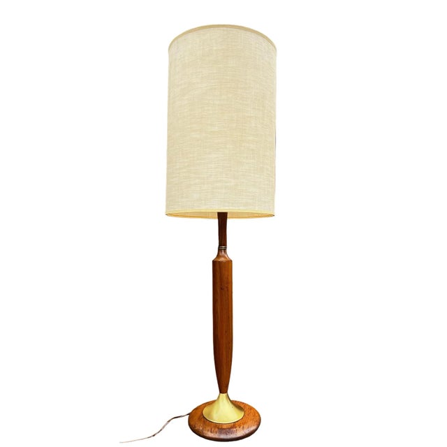 This fashionable and sophisticated table lamp is the quintessential example mid-century modern style. Crafted with teak...