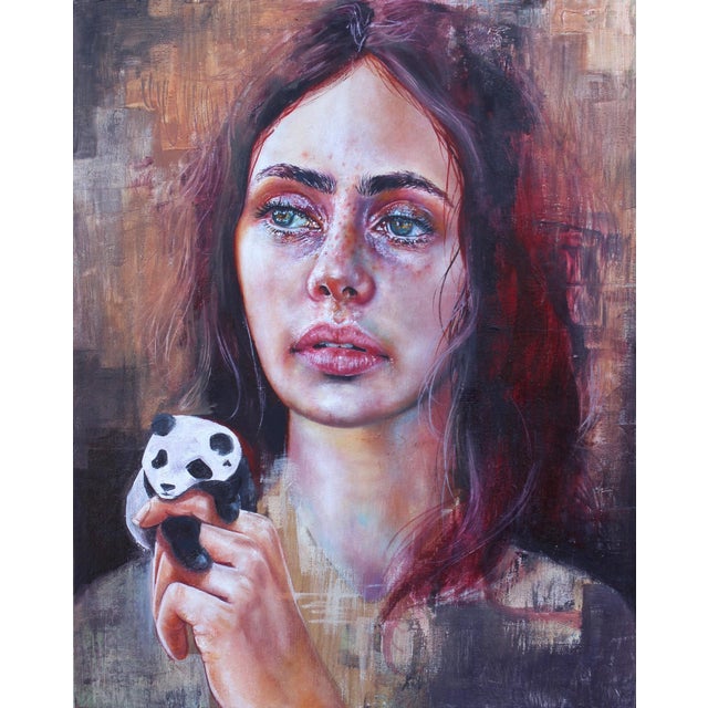 The painting features a young woman gazing intently, holding a small panda toy close to her chest. Her expressive eyes and...