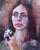 The painting features a young woman gazing intently, holding a small panda toy close to her chest. Her expressive eyes and...