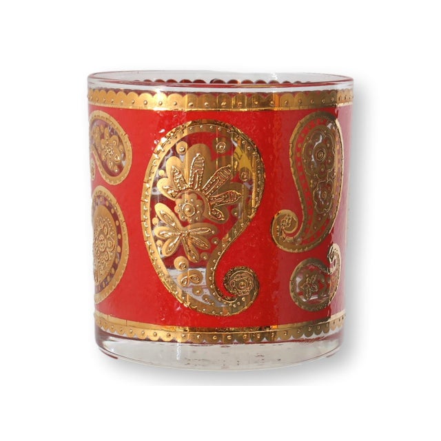Midcentury Culver old fashioned glasses in the iconic red paisley pattern, featuring a richly saturated red ground adorned...