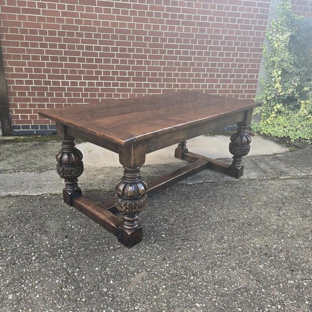 Superb four plank Elizabethan style oak H frame dining table with huge bulbous legs, cleated top, in excellent overall...