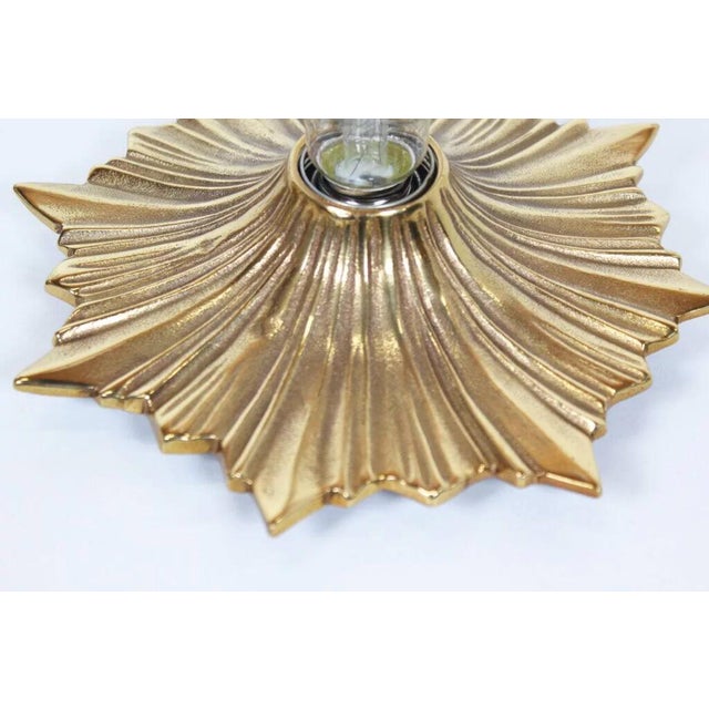Heavy mid-century bronze sunburst fixtures that can be used as sculptural wall lights or compact flush mount ceiling...