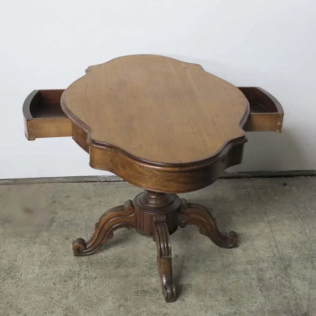 This side table was designed during the Gründerzeit-Wilhelminian time period. It features two drawers.