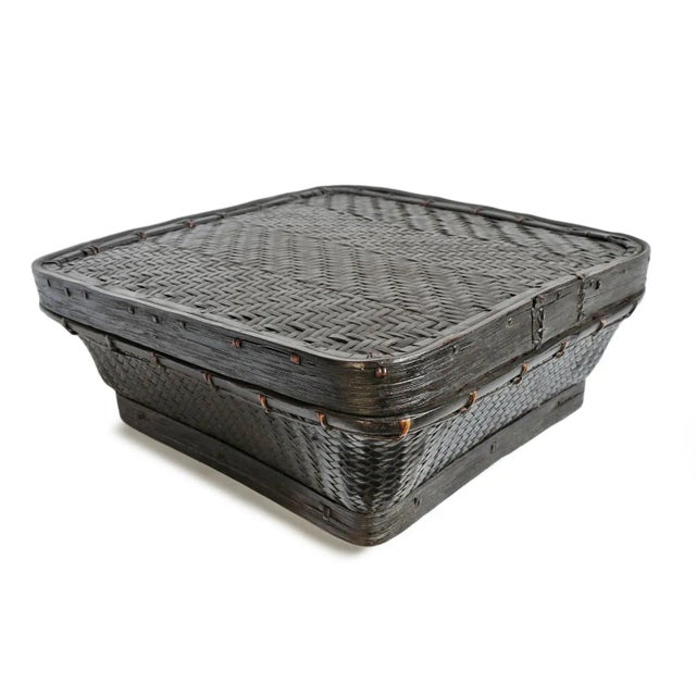 Vintage Akha hill tribe basket from Northern Thailand. Beautiful handwoven bamboo storage vessel featuring a softly...