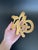 A vintage brass trivet in the form of the Chinese Fortune symbol, representing good luck, happiness, prosperity, and...