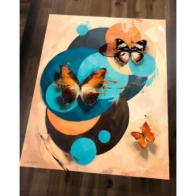 Kaleidoscope #1 features a dynamic composition of vibrant butterflies set against a backdrop of bold, circular shapes in...