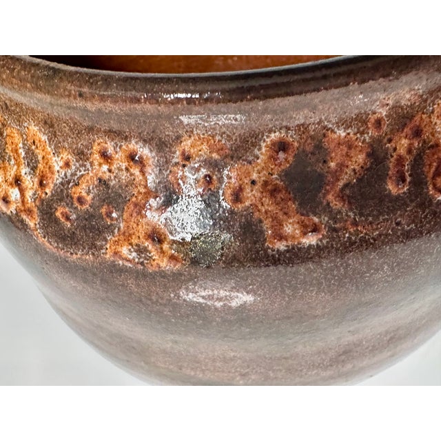 Handmade planter by the German ceramicist Helma Klett (1908-1996), decorated in her signature warm, earthy brown-ochre...