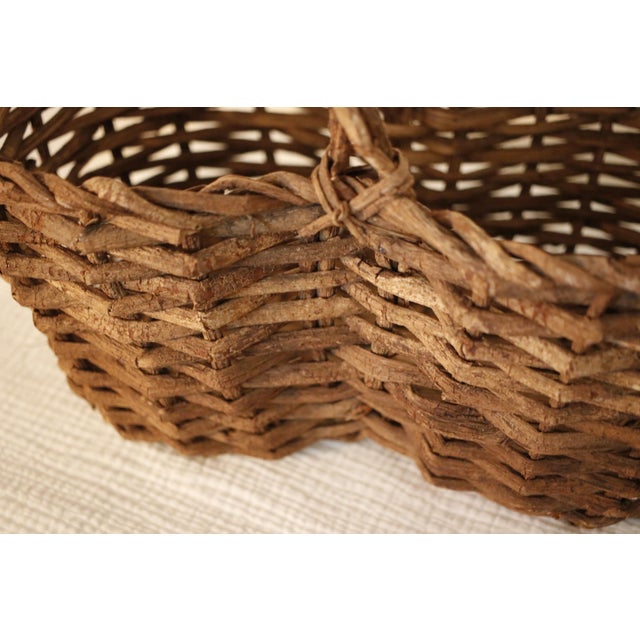 Bring a touch of authentic French countryside charm to your home with this rare antique gathering basket. Handwoven from...