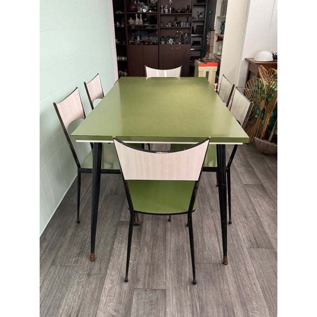 The set consists of a table and 6 chairs. Made in Italy in the 1960s, it is a classic example of 1960s Italian modernism,...