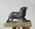A small bronze sculpture in the shape of a very detailed and finely executed cavalier king charles spaniel. We attributes...