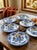 This refined set of six rimmed deep plates displays one of the most iconic English ceramic designs. The central scene...