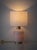 A pair of hand-blown Murano glass lamps in milk-white opaline combining refined Venetian craftsmanship with a rare and...