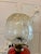 A beautiful mid-Victorian cranberry glass oil lamp mounted on an elegant brass Corinthian column base. The lamp features a...