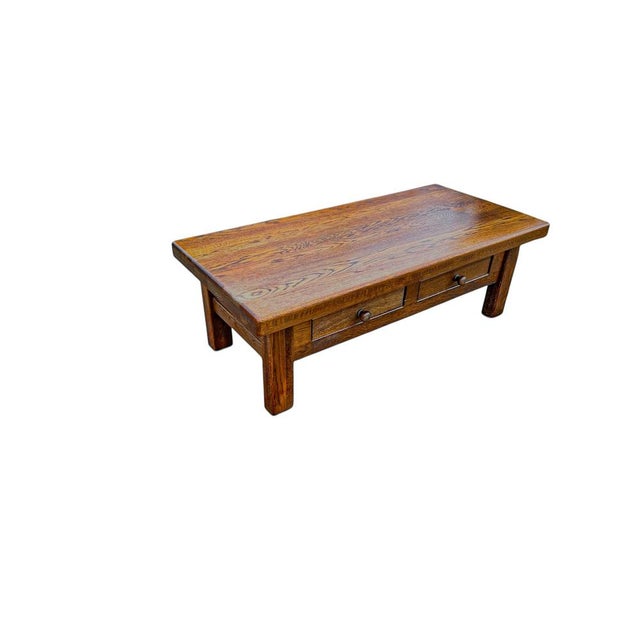 Robust thick oak coffee table with two drawers, 1970s from the Netherlands. The table is very solid and of good, heavy...