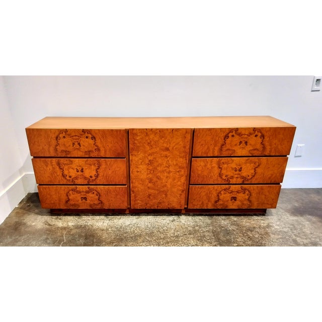 Classic Milo Baughman designed Lane credenza, streamlined rectangular form with integrated pulls, raised on recessed...