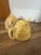 Vintage ceramic teapot with a crackle-glaze yellow finish and a hand-painted white magnolia flower design. Includes...