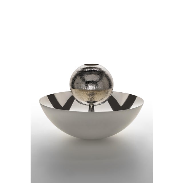 This centerpiece features the SAHARA &amp; AGHI VERTICAL textures with a polished and a satin finish.