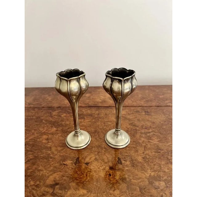 Lovely pair of Art Nouveau silver plated spill vases having a lovely pair of silver plated spill vases standing on...