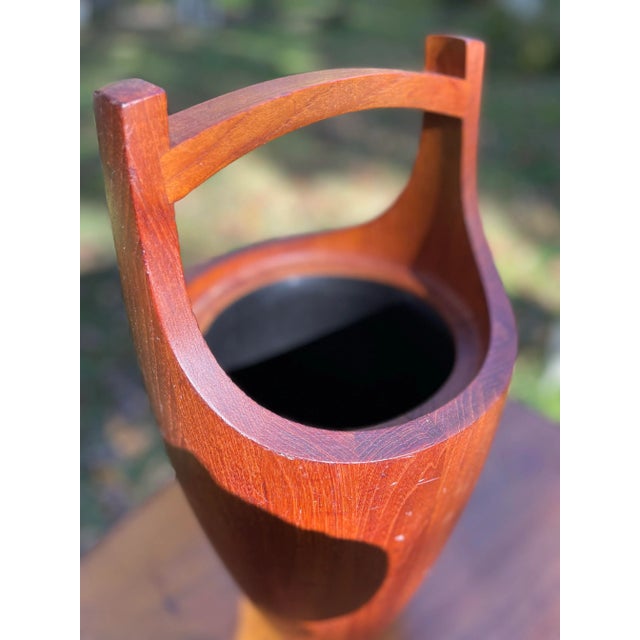 This vintage ice bucket is a unique addition to any barware collection. Vintage & Crafted from teak wood, it showcases a...