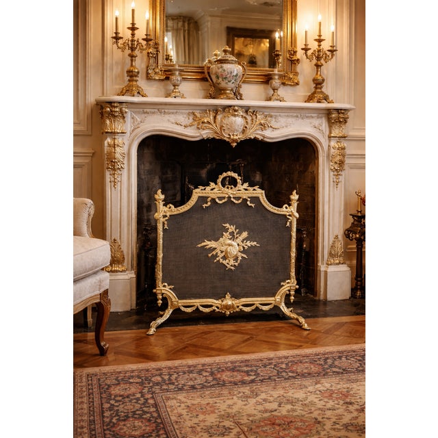 19th Century French Louis XVI Gilt Bronze Fireplace Screen This refined 19th century French fireplace screen is a...