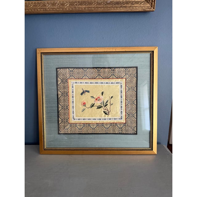 This is a framed Chinese silk embroidery panel featuring flowers and a dragonfly. The piece is a form of traditional...