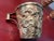 Beautiful ornate copper mug. Farmer and 4 cattle in relief.