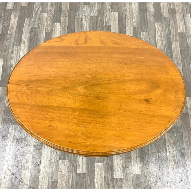 This is a gorgeous antique Victorian style oval parlor table or accent table with a stunningly carved and turned base....