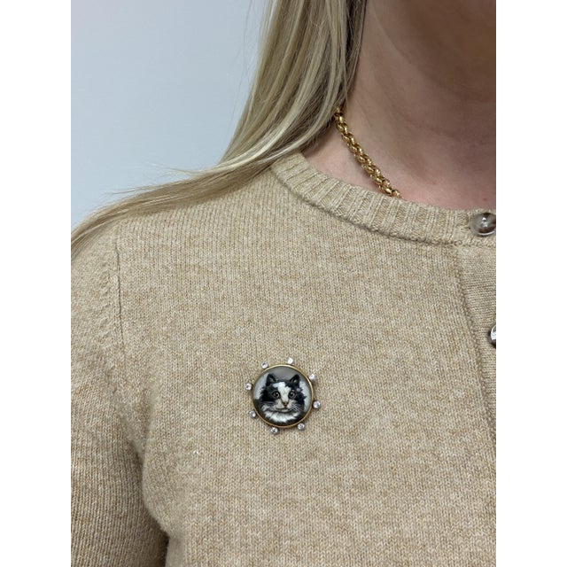 This special brooch is from the Belle Epoque era, made in France, consisting of an essex crystal cat face mounted in 18...