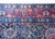A remarkable early 20th century Persian Kirman rug with the most wonderful mirrored floral pattern woven in jewel-toned...