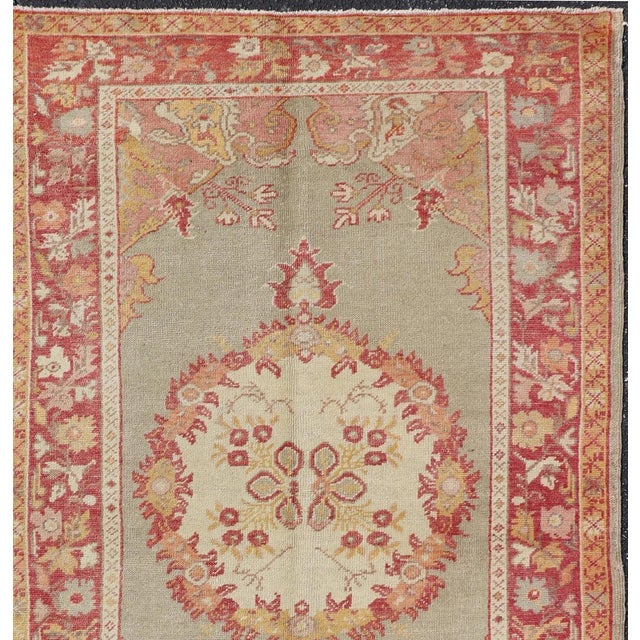 Turkish Oushak vintage rug with floral medallion design in red and light blue, Keivan Woven Arts / rug EN-461, country of...