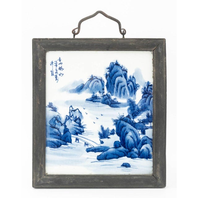Group of Three Chinese Blue and White Porcelain Plaques, each hand-painted with river and mountains landscape scene, two...