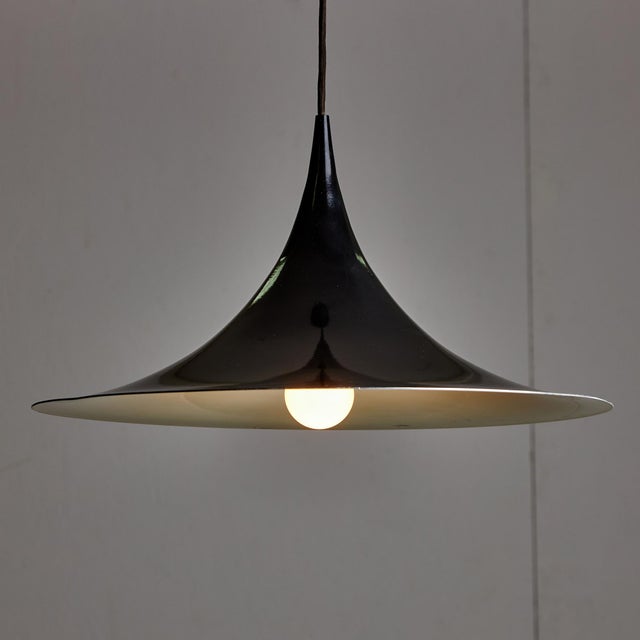 Presenting a pendant light that captures the essence of minimalist design. The silhouette radiates simplicity, fitting...