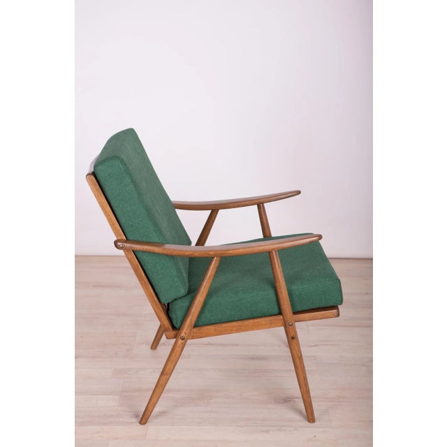 This armchair was produced by the Czechoslovakian company TON in the 1960s. The beech elements have been cleaned and...