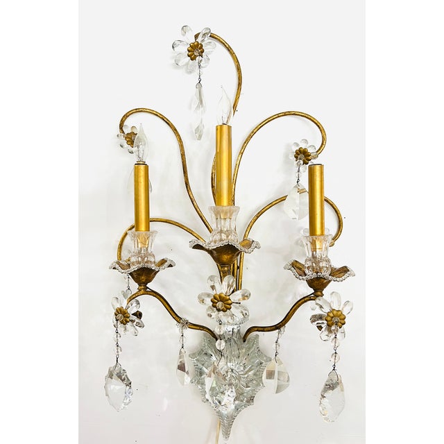 Beautiful pair of 3 light crystal wall sconces from Italy. 3 golden candles with crystal holder and gold metal bobeches...