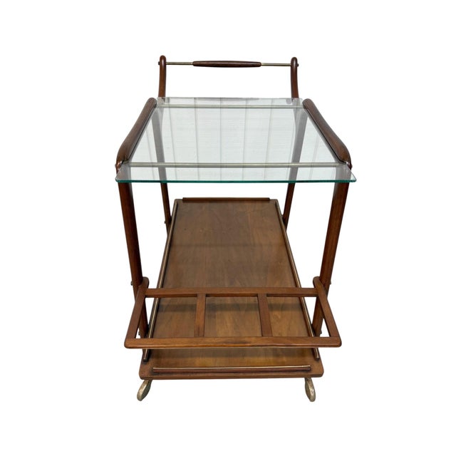 Bring timeless Italian design into your home with this stunning Mid-Century Modern walnut serving cart, crafted in Italy...