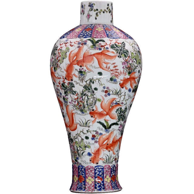 This large antique Chinese Famille Rose porcelain temple jar makes a radiant statement with its joyful goldfish motif and...