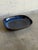 This vintage ceramic serving platter features a striking organic shape with an elegant recessed center. The interior...