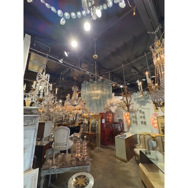 Experience the elegance of the Modern Fontana Green Murano Glass "Tronchi" Chandelier, a stunning addition to any interior...