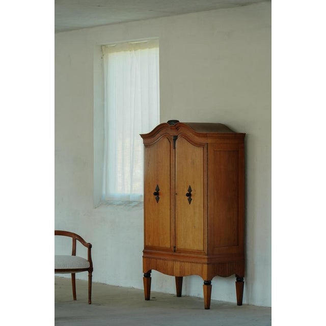 Beautiful Danish Art Deco cabinet crafted in solid oak during the early 20th century. The piece features an elegant...