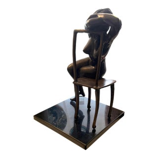 Artist Executed Bronze Female Sculpture Resting on Chair Stone Base For Sale