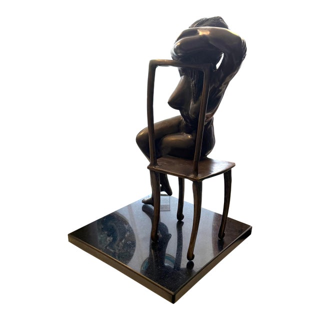 Artist Executed Bronze Female Sculpture Resting on Chair Stone Base For Sale