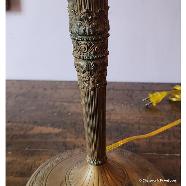 This is a fantastic example of a Art-Nouveau period, 1920s metal & slag glass table lamp from Edward Miller & Co of...