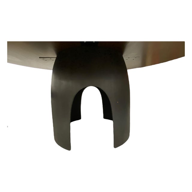 Ty Best Bannack dining table with hand carved solid walnut base in a black finish and a solid oak top in a dark brown...