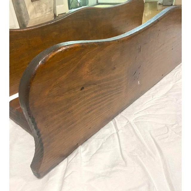 A charming pair of antique Arts & Crafts wall shelves featuring scalloped apron details and warm aged wood. Perfect for...